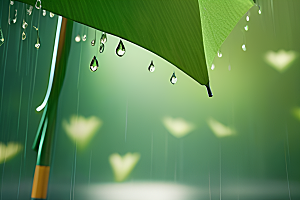 绿色背景中的雨滴与雨伞