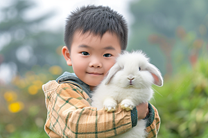 儿童和兔子童趣生活摄影图