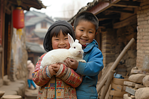 儿童和兔子生活童趣摄影图