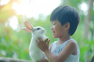 儿童和兔子清新自然摄影图