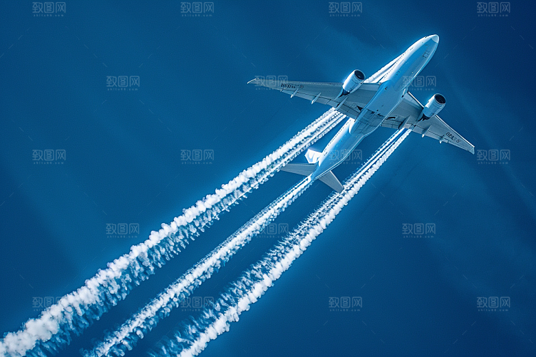 飞机飞翔白云高空摄影图