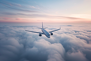 飞机飞翔客机白云摄影图