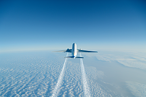 飞机飞翔高空蓝天摄影图