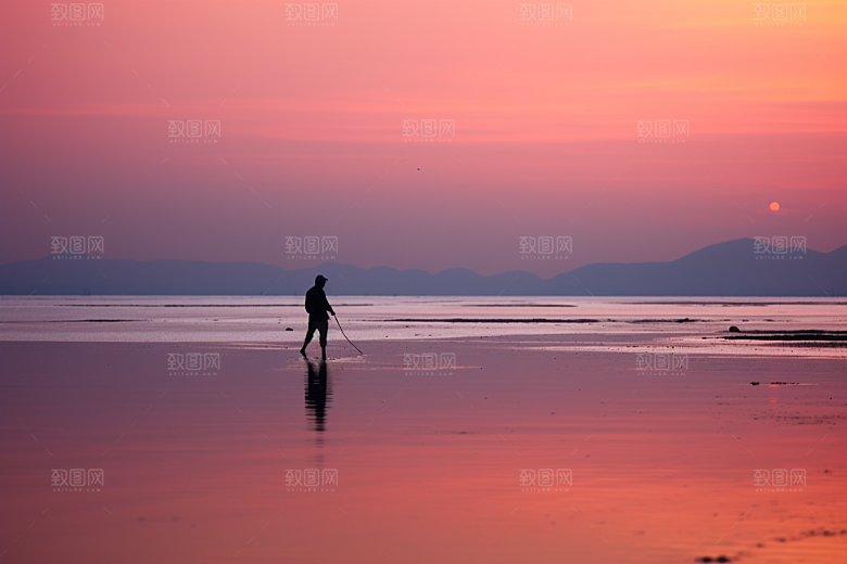 海边赶海渔获余晖摄影图