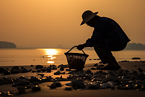 海边赶海落日黎明摄影图