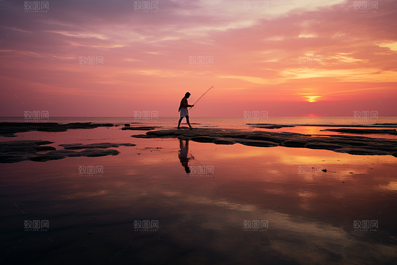 海边赶海落日捕捞摄影图