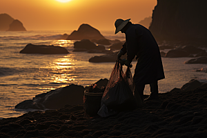 海边赶海礁石夕阳摄影图