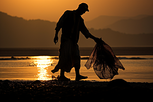 海边赶海渔获落日摄影图