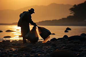 海边赶海夕阳礁石摄影图