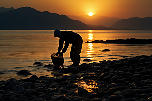 海边赶海余晖落潮摄影图