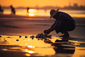 海边赶海余晖落潮摄影图