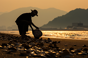 海边赶海余晖落潮摄影图