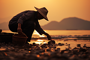 海边赶海落日海货摄影图