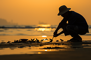 海边赶海余晖滩涂摄影图