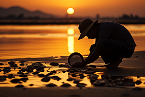 海边赶海清晨夕阳摄影图