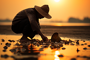 海边赶海海滩夕阳摄影图