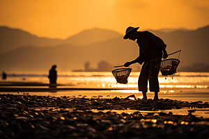 海边赶海夕阳落潮摄影图