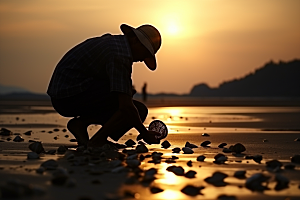 海边赶海落日余晖摄影图