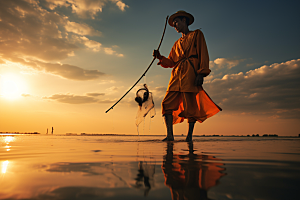 海边赶海海滩余晖摄影图