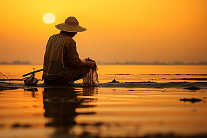 海边赶海余晖滩涂摄影图