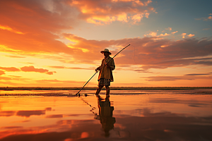 海边赶海夕阳清晨摄影图