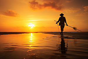 海边赶海夕阳潮汐摄影图