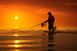 海边赶海余晖清晨摄影图