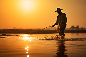 海边赶海夕阳落日摄影图