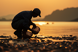海边赶海余晖潮汐摄影图