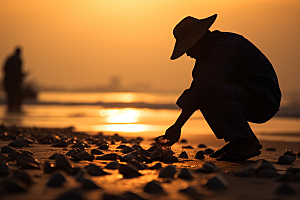 海边赶海夕阳海货摄影图