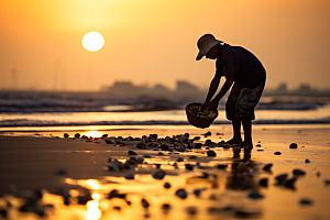 海边赶海余晖滩涂摄影图