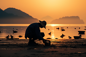 海边赶海清晨渔获摄影图