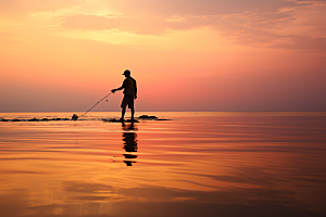 海边赶海夕阳落日摄影图