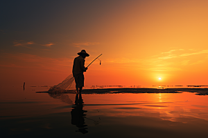 海边赶海落日黎明摄影图