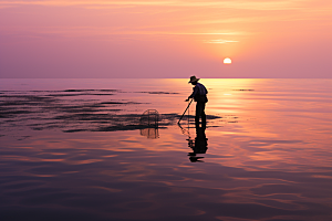 海边赶海余晖落潮摄影图