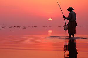 海边赶海潮汐落日摄影图