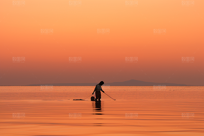 海边赶海礁石清晨摄影图