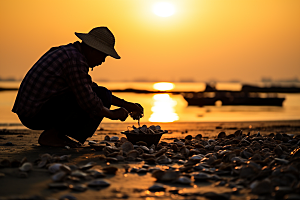 海边赶海夕阳落日摄影图