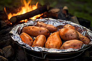 烤红薯地瓜冬天摄影图