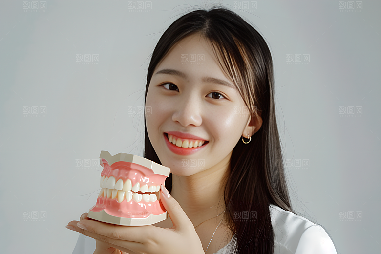 牙科广告人物牙病防治假牙模型摄影图