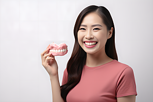 牙科广告人物假牙模型笑容摄影图
