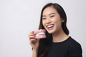 牙科广告人物假牙模型科普摄影图