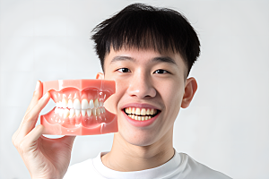 牙科广告人物人物肖像假牙模型摄影图