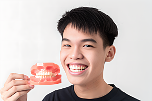 牙科广告人物看牙医假牙模型摄影图