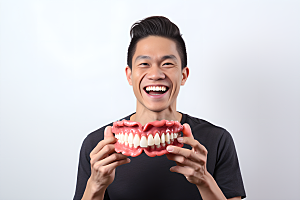 牙科广告人物假牙模型看牙医摄影图