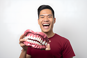 牙科广告人物假牙模型牙科诊所摄影图