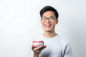 牙科广告人物假牙模型牙病防治摄影图