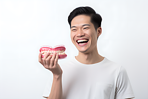 牙科广告人物假牙模型口腔医院摄影图