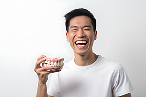 牙科广告人物假牙模型科普摄影图