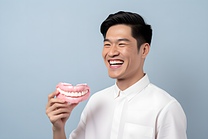 牙科广告人物高清假牙模型摄影图